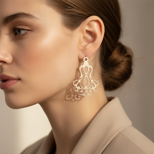 Alternate angle of filigree drop earring worn on ear