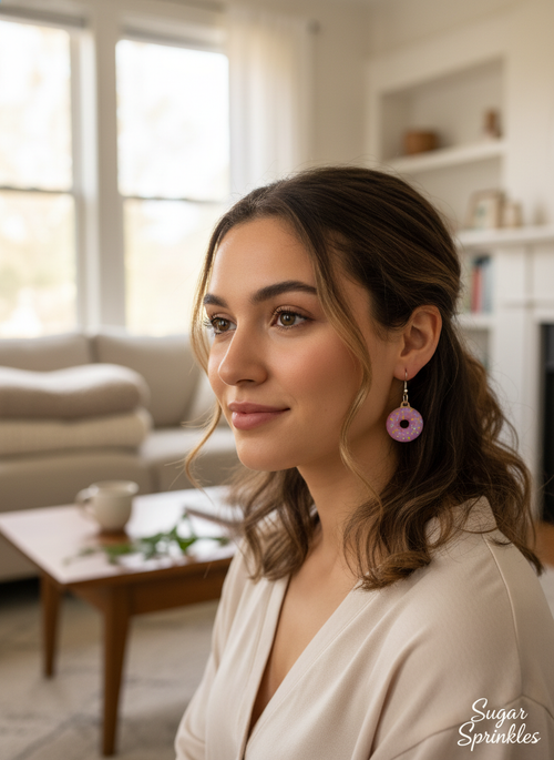 Side-angle lifestyle photo of donut-shaped 3D-printed earrings being worn